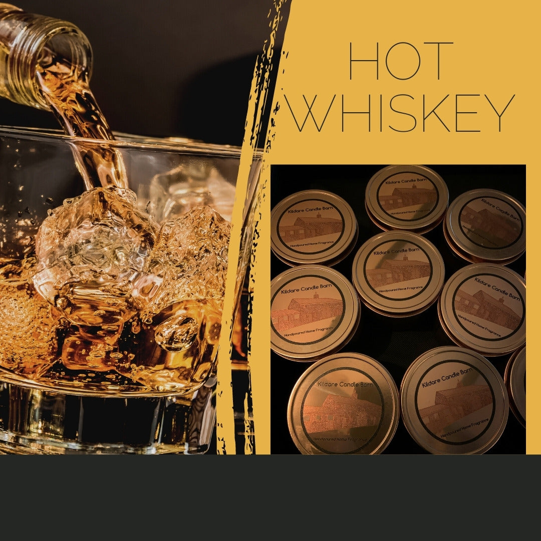 A glass of hot whiskey with a label that reads 'HOT WHISKEY' in bold, and a series of tin candles