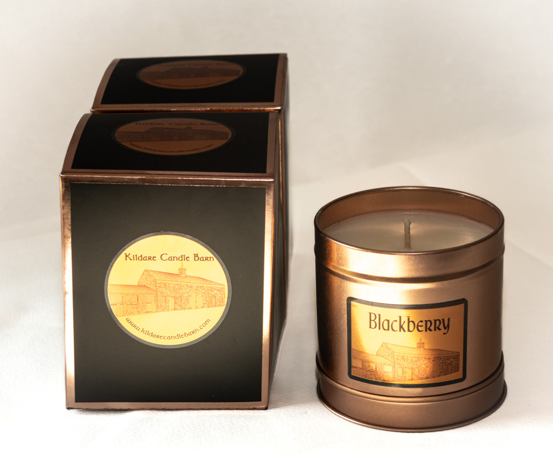 Copper candle with 'Blackberry' label and matching box on a white background